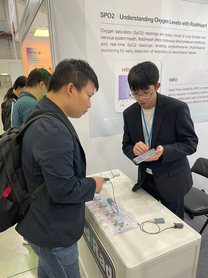 Visitors trying the RadiHeart sensor